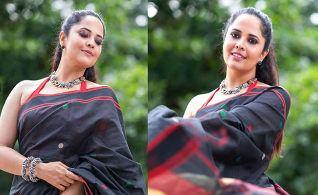 Anasuya Bharadwaj Poses In Black Saree Stills